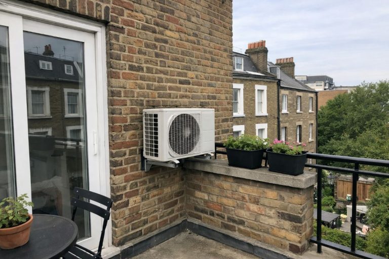 an illustrative image of an exterior flat in london with an AC unit mounted to the wall