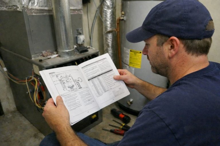 an illustrative image of a HVAC engineer reviewing a manual