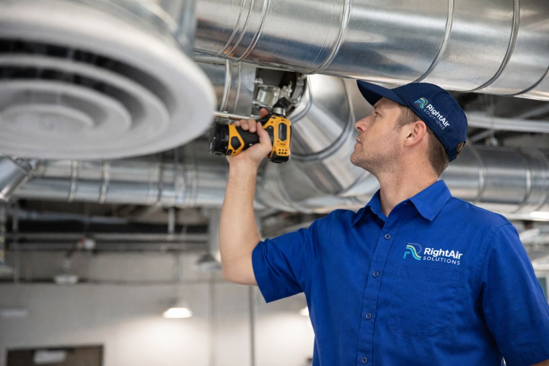 AI image of HVAC technician working on ducts