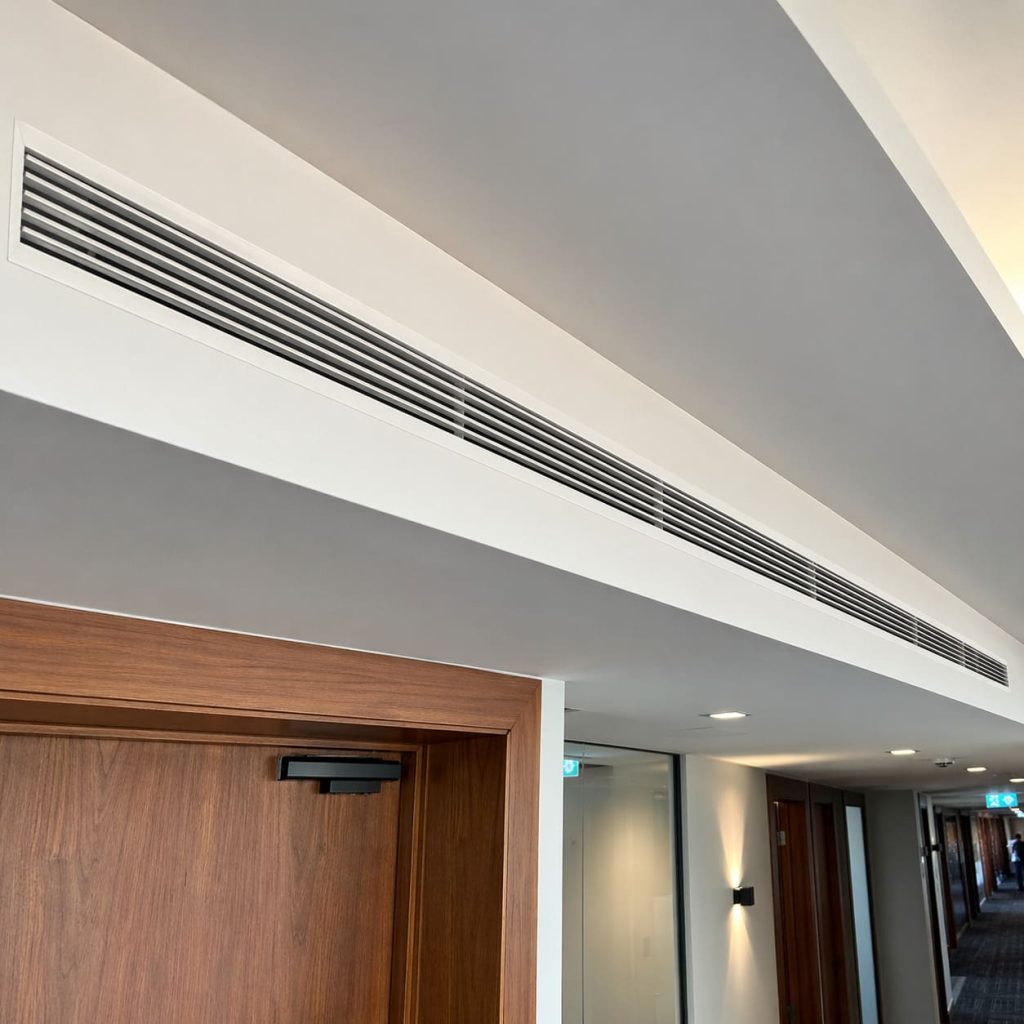 Ducted Air Conditioning Linear Grille Installation in Executive Office Corridor - Illustrative Image