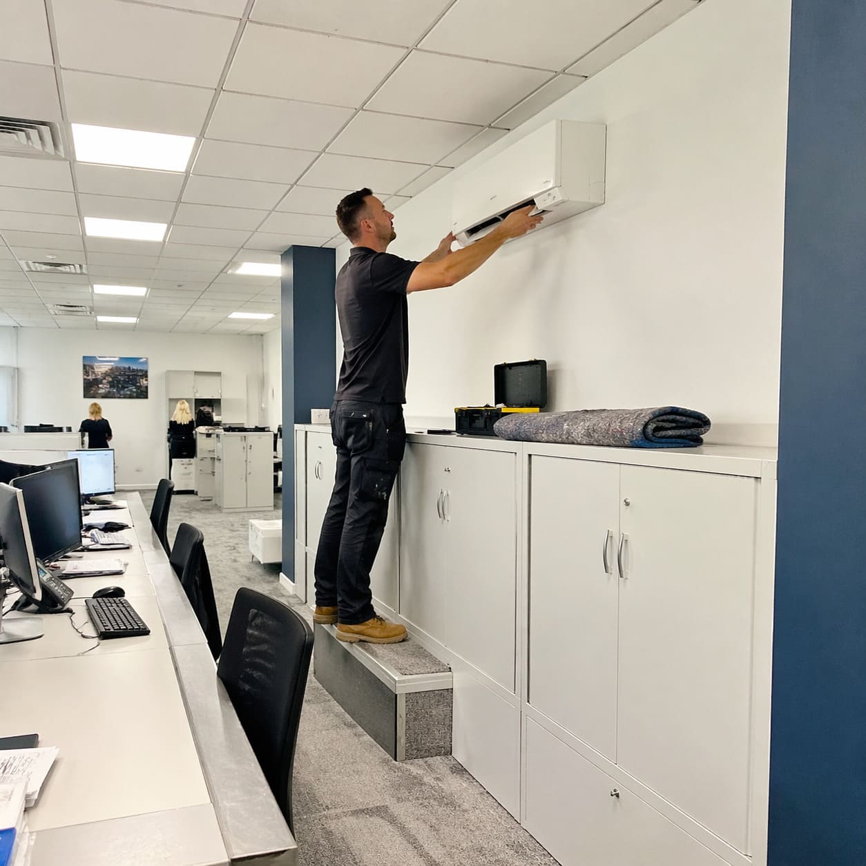 Office Air Conditioning Wall Unit Installation in Insurance Office – Illustrative Image